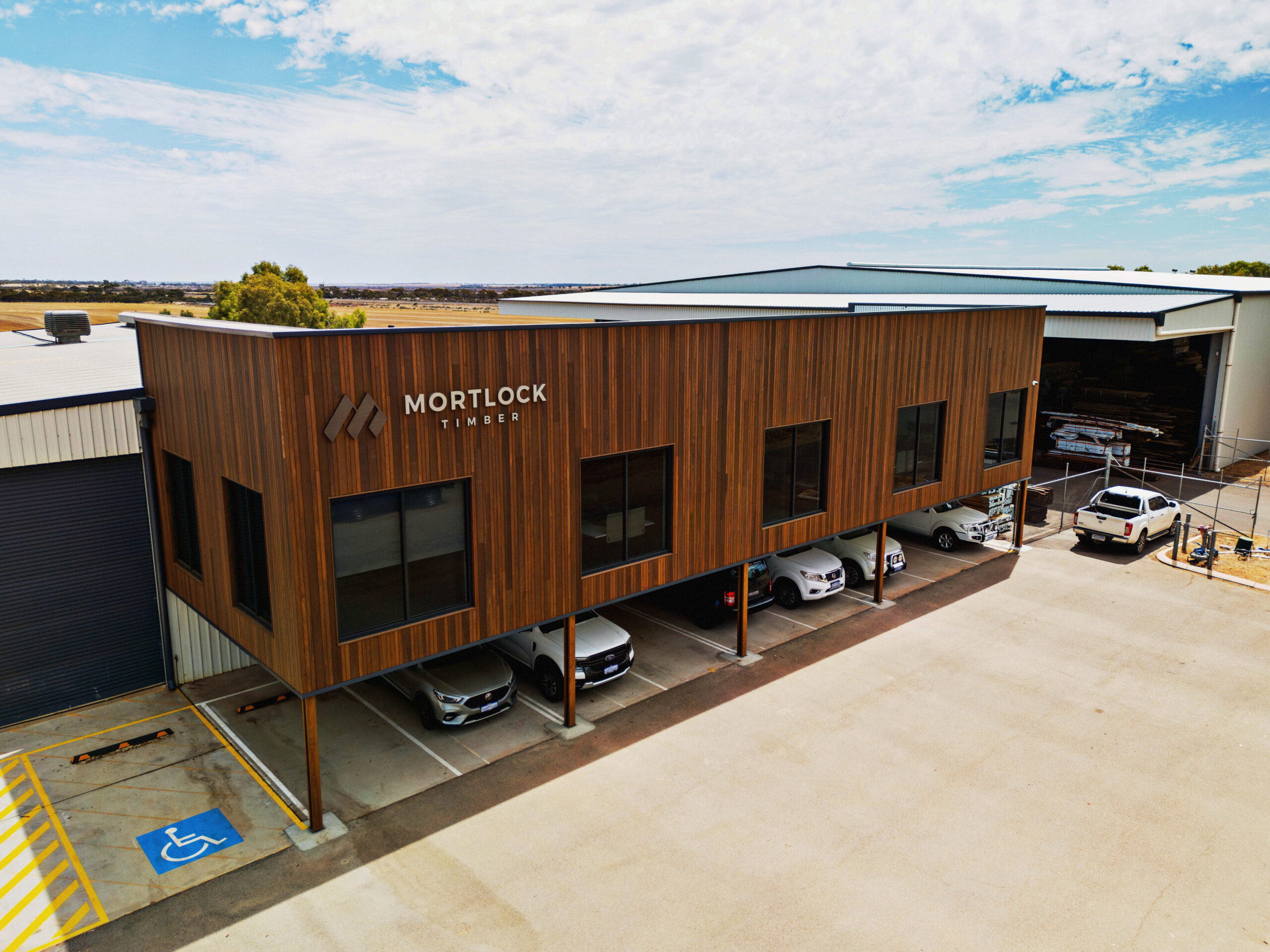 Drone image of the front of Mortlock Timber Building showcasing 135x19 Trendplank Tulipwood & 70x19 Trendplank Tulipwood