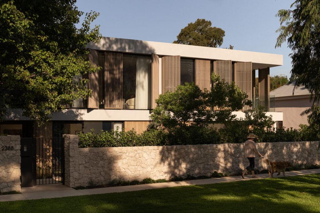 Burnt Ash TRENDPLANK timber cladding and vertical timber detailing across the exterior of The Patina House in Cottesloe, contrasting with white rendered walls and natural stone landscaping.